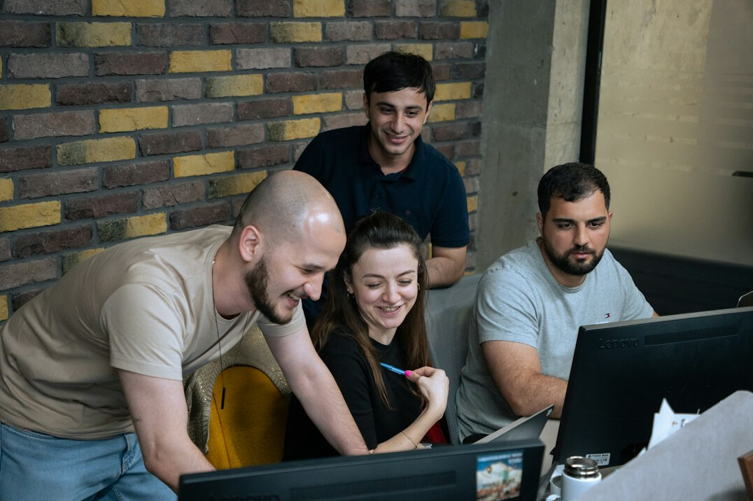corporate team discussing code