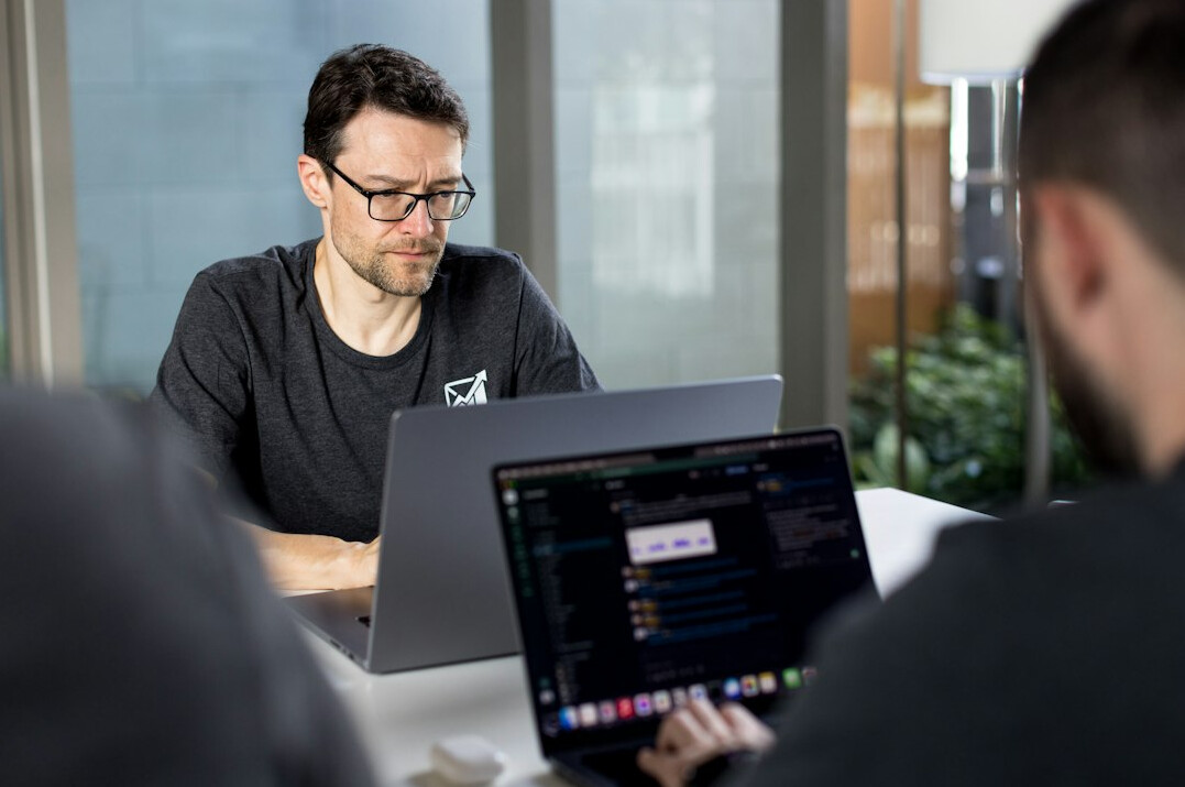 business team discussing code