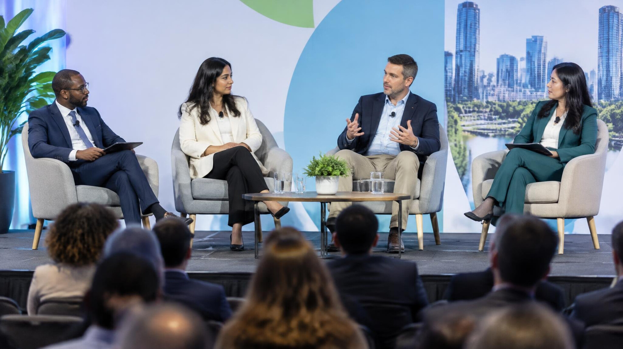 Corporate conference room with panel discussion on stage
