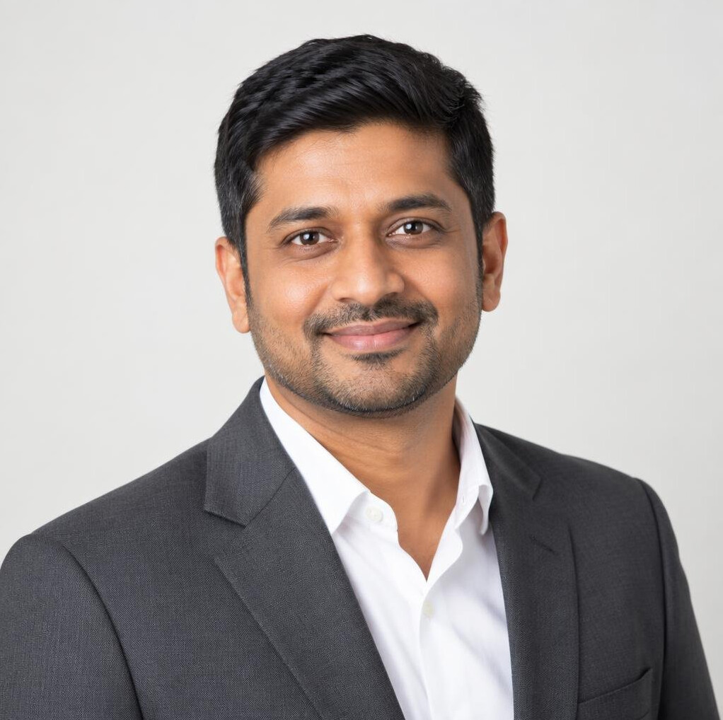 Studio portrait of an Indian-Singaporean man in business attire