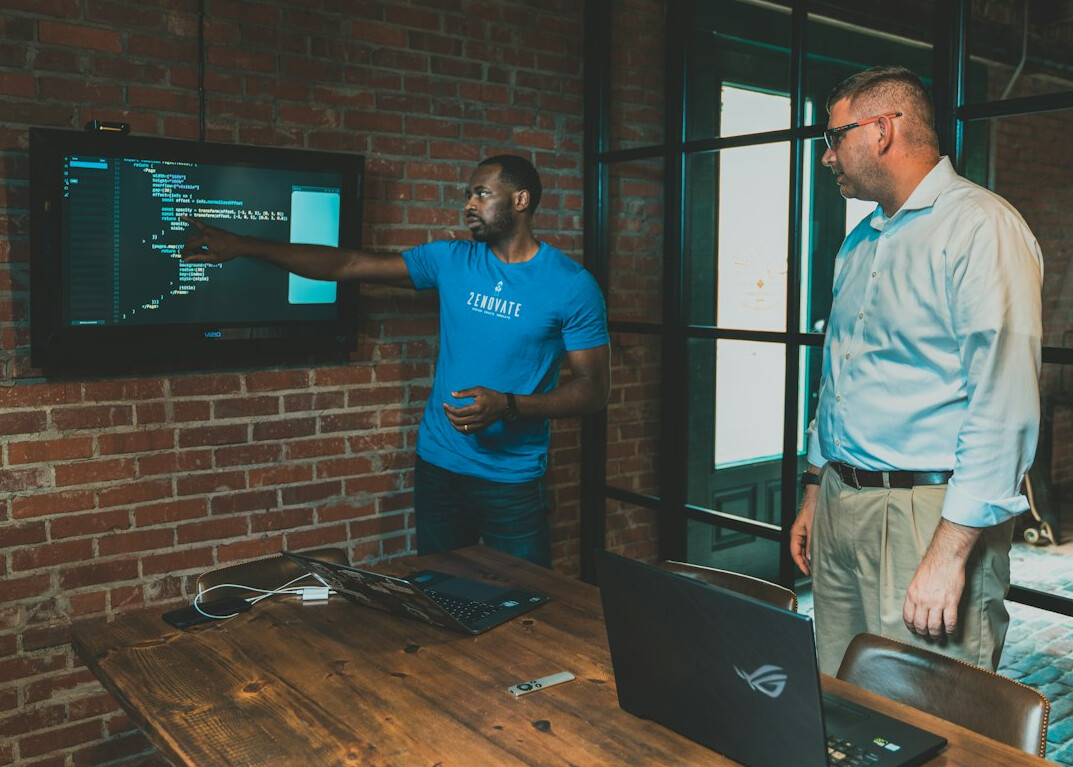 corporate team discussing code